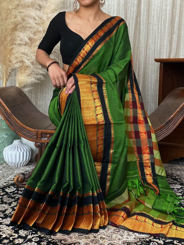 https://pouranicsilks.in/product/pure-handloom-saree-in-plain-dual-look-gray-colour-with-black-and-golden-wide-zari/