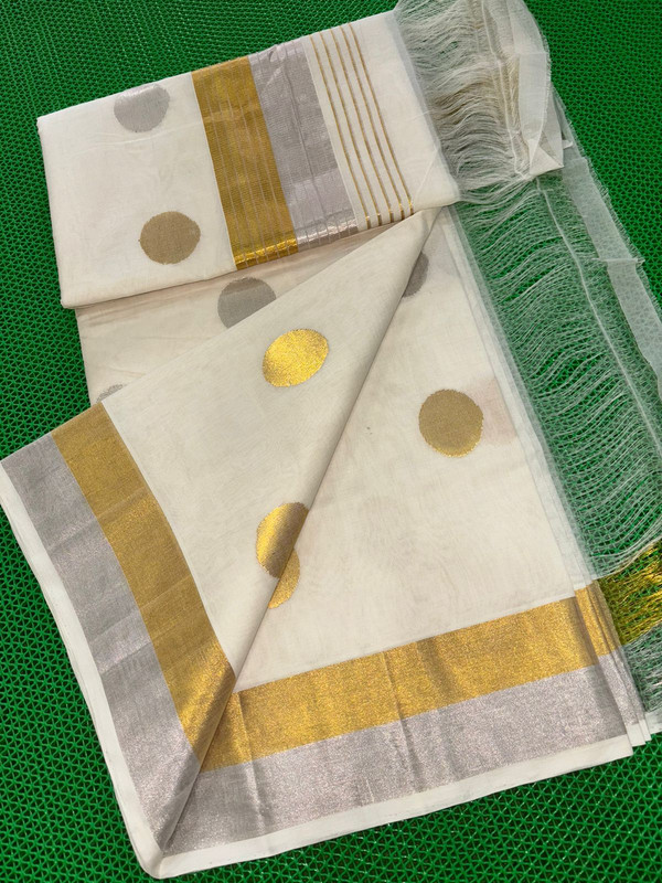 Kerala Handloom with Golden and Silver Circle Putta's and Beautiful Riched Work Pallu along with wide Golden and Silver Zari Combo Border