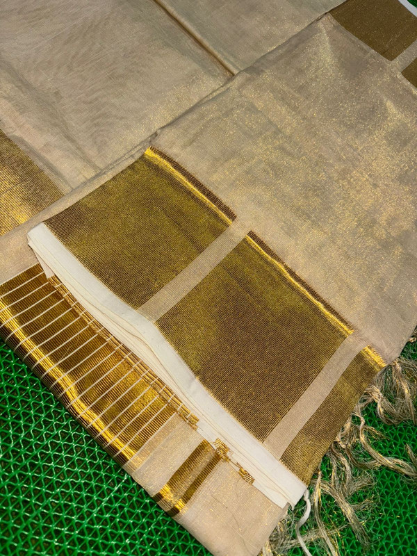 Kerala Handloom Tissue saree with Beautiful Rich Golden Block Design Border Pallu. Grand Saree For Bridal Specially and other auspicious occasions.