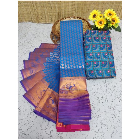 Soft Semi Silk Saree, Well used for Festivals, Weddings, Gatherings . Shinning Blue with Putta's in the whole saree aling with the beautiful Wide Zari Golden Design Border and Rich work Palllu in Maganta colour. The Blouse pices attached looks extremly gorgeous.